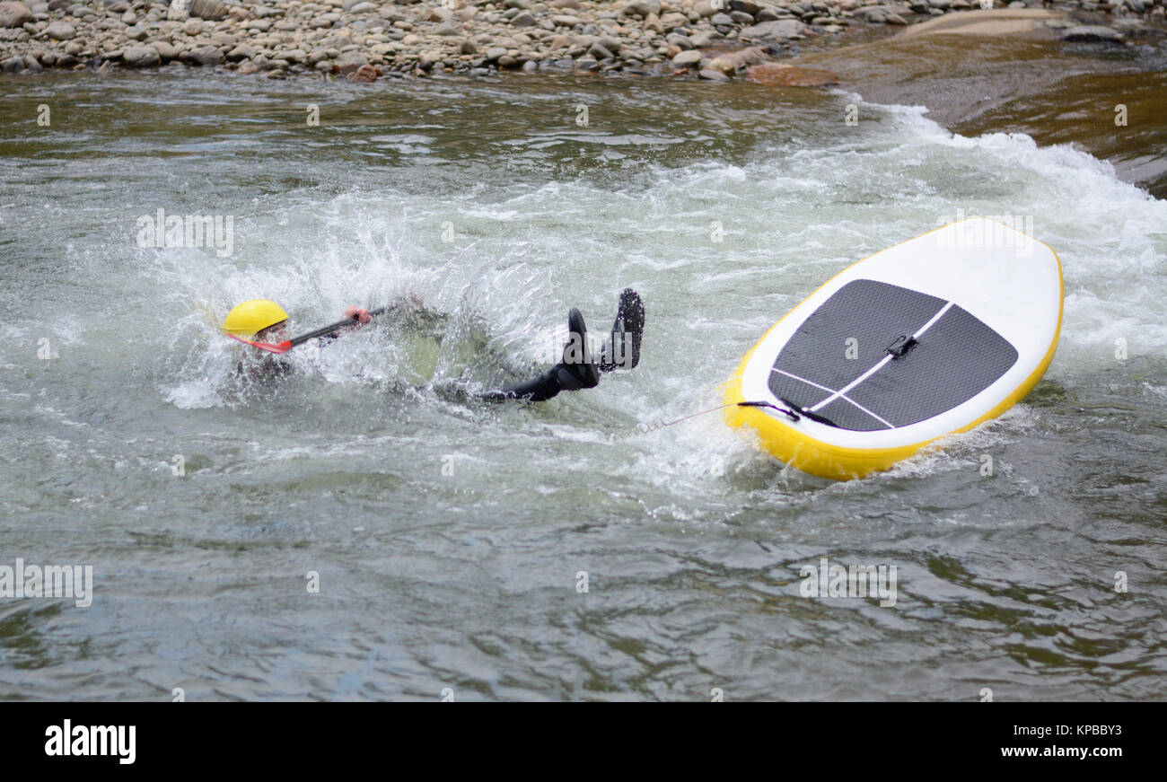 White water river surfing wipe out on Clear Creek River in Golden Colorado Stock Photo