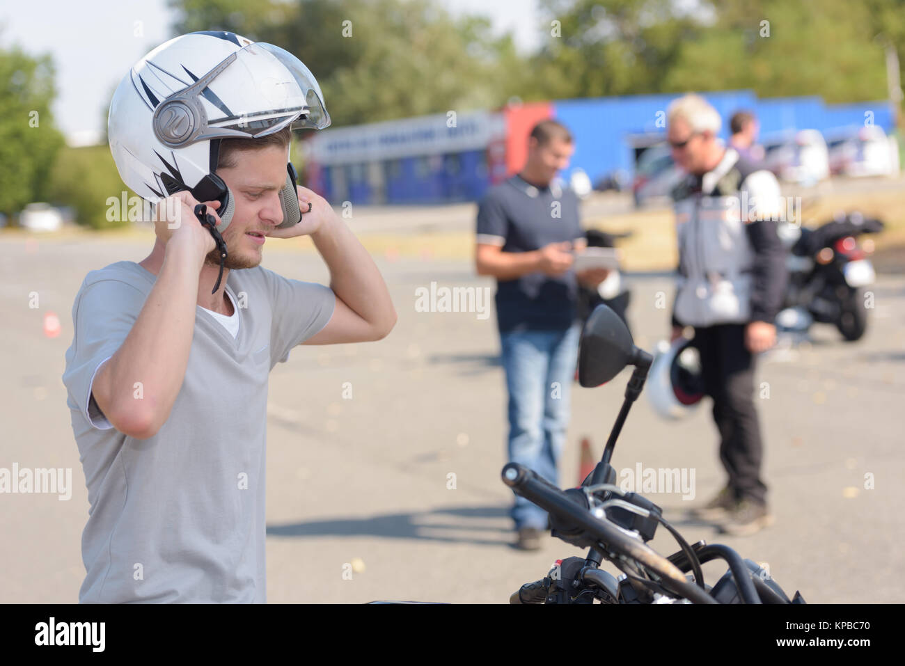 young man learning how to ride a motorbike Stock Photo