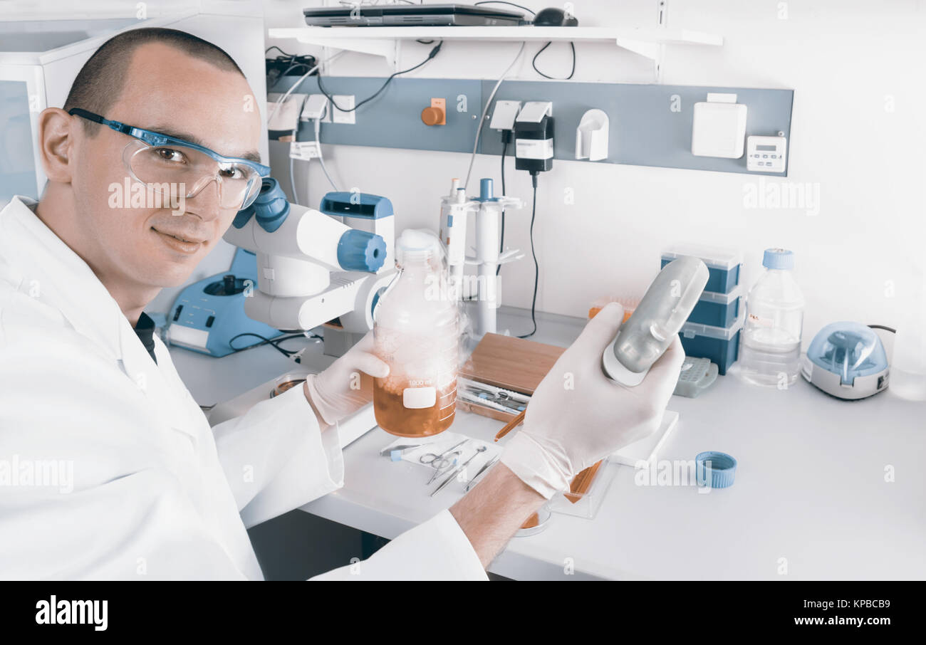 Young scientist or tech works in modern laboratory Stock Photo