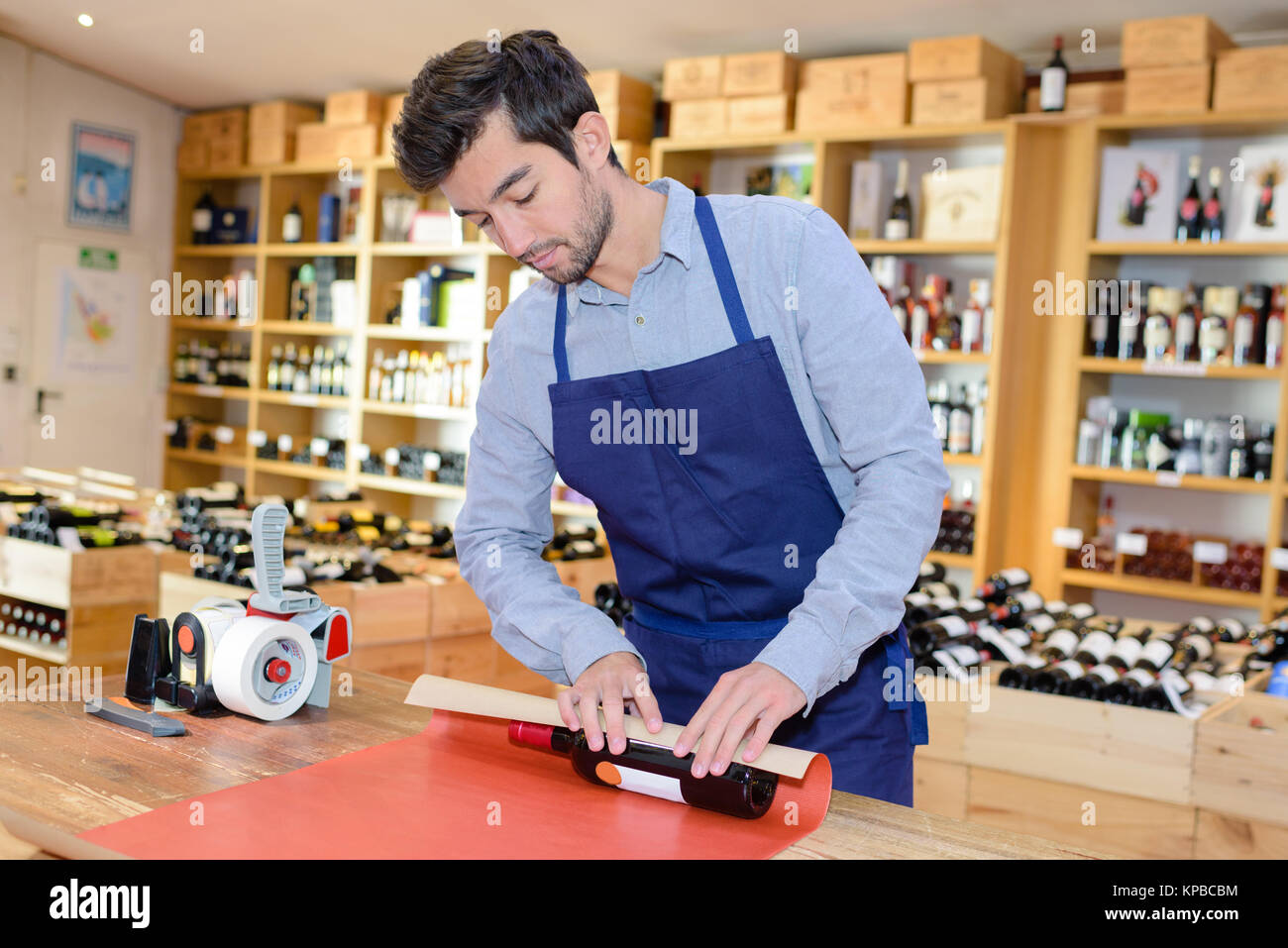 sommelier preparing wine bottle for a present Stock Photo Alamy