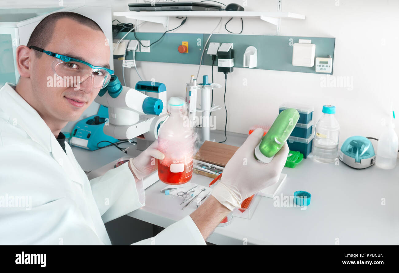 Young scientist or tech works in modern laboratory Stock Photo