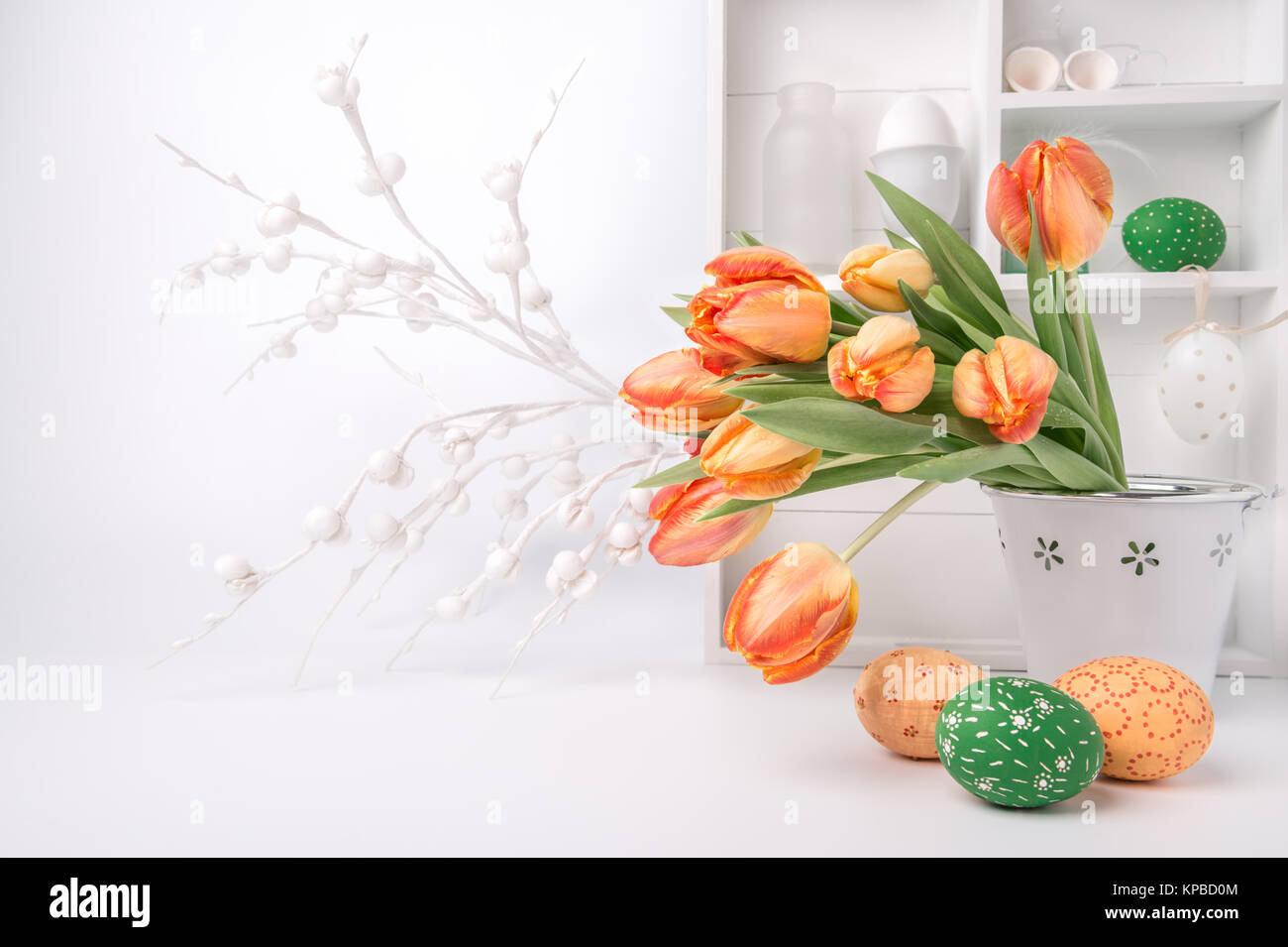 Easter greeting card design with bunch of tulips and painted eggs on ...