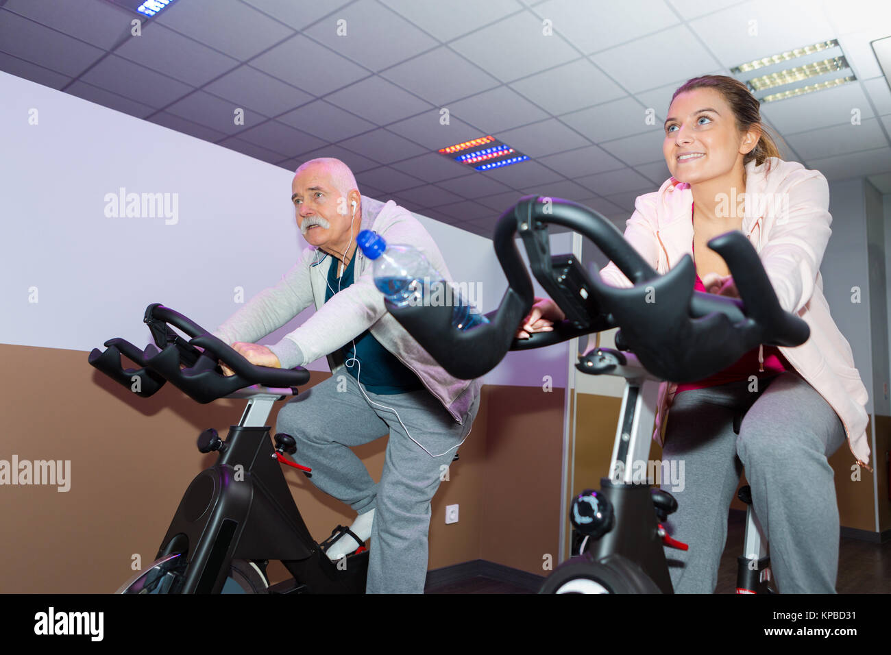 happy senior people group exercising in spinning class in gym Stock ...