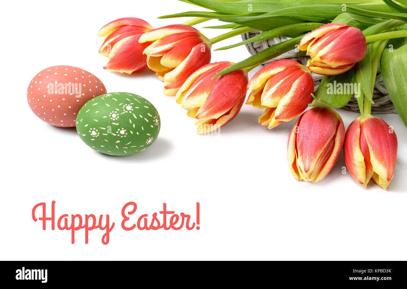 Bunch of stripy tulips and two Easter eggs on white background. Corner ...