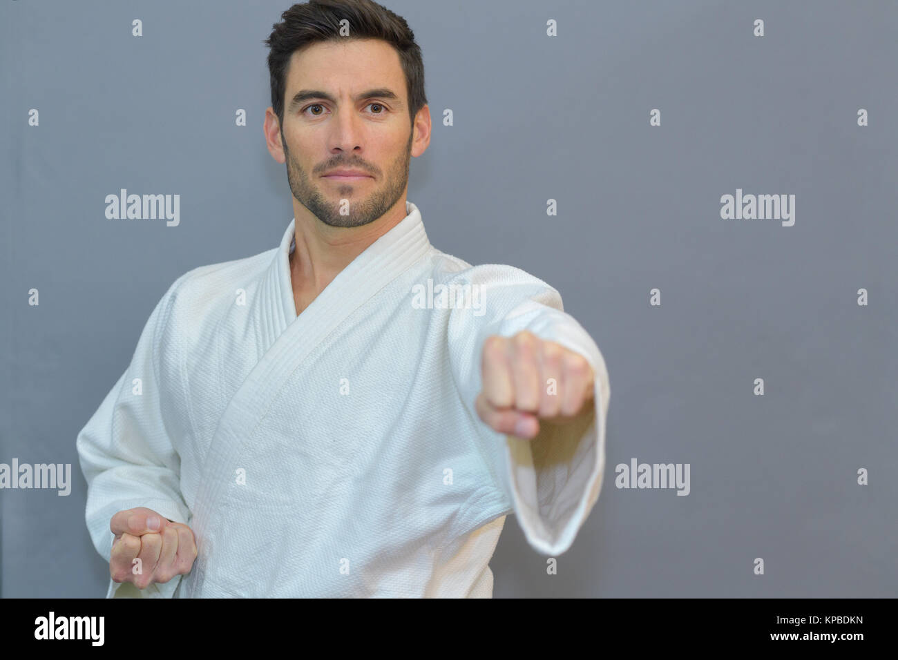 man karate player in white kimono Stock Photo