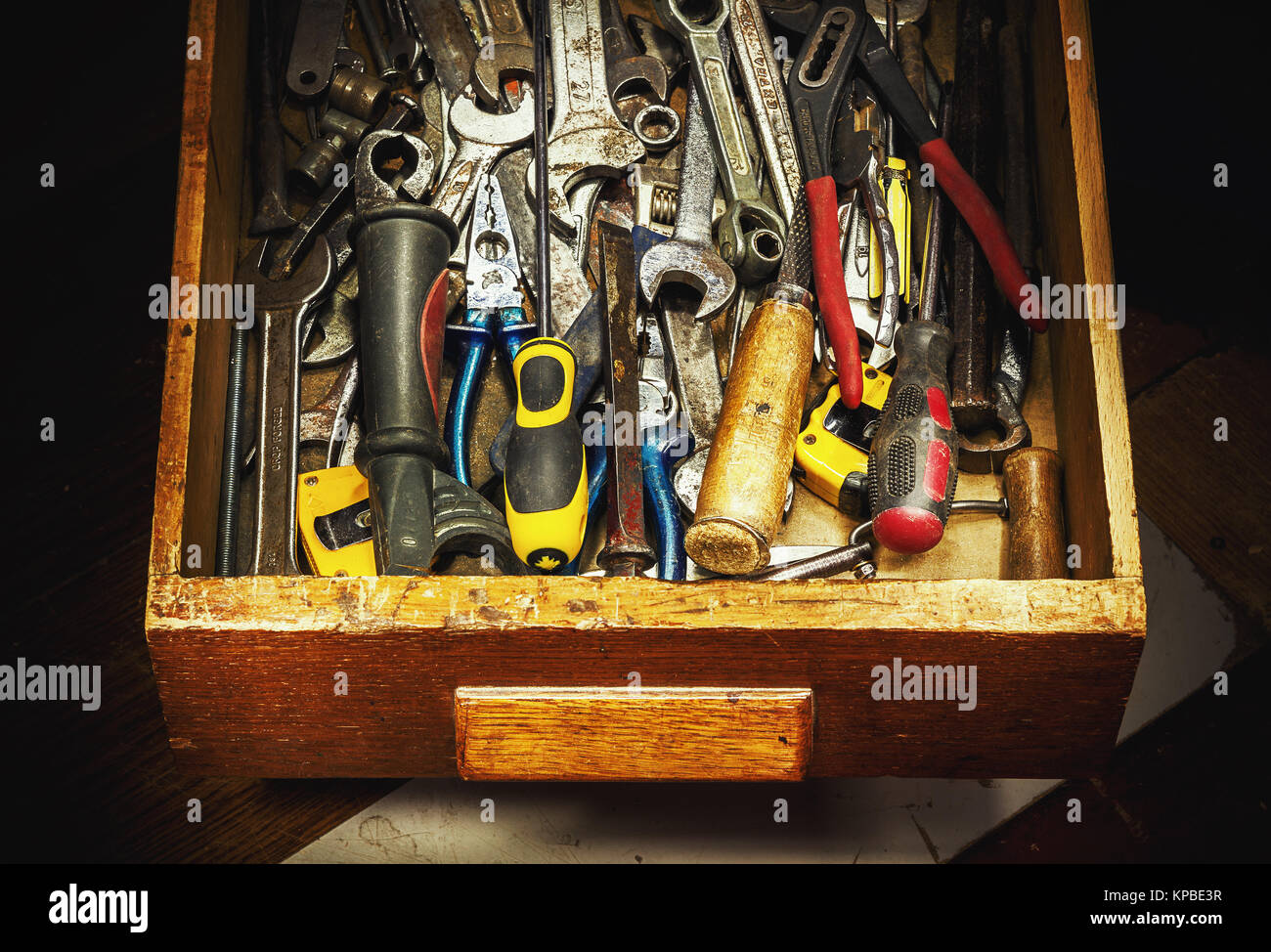 Closeup view of drawer full of old used tools. Stock Photo