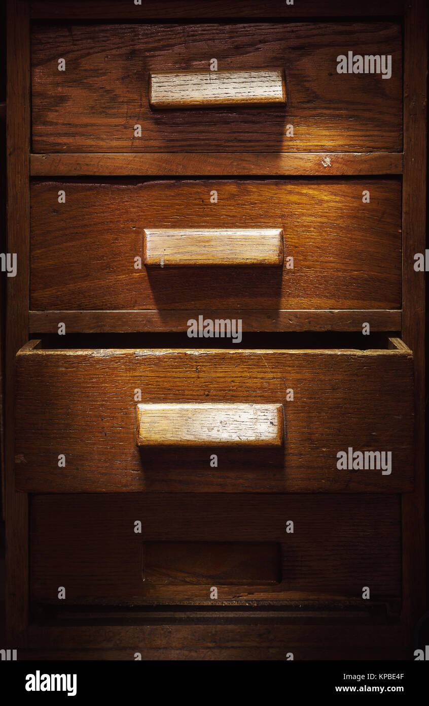 Closeup View Of Old Wooden Closet With Four Drawers One Is Opened