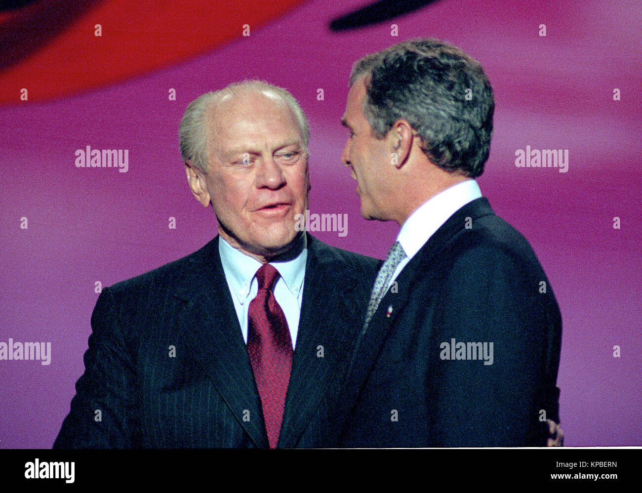 Former United States President Gerald R. Ford, left, and Governor George W. Bush (Republican of Texas), right, on the podium at the 1996 Republican National Convention at the San Diego Convention Center in San Diego, California on August 12, 1996.   Credit: Ron Sachs / CNP /MediaPunch Stock Photo