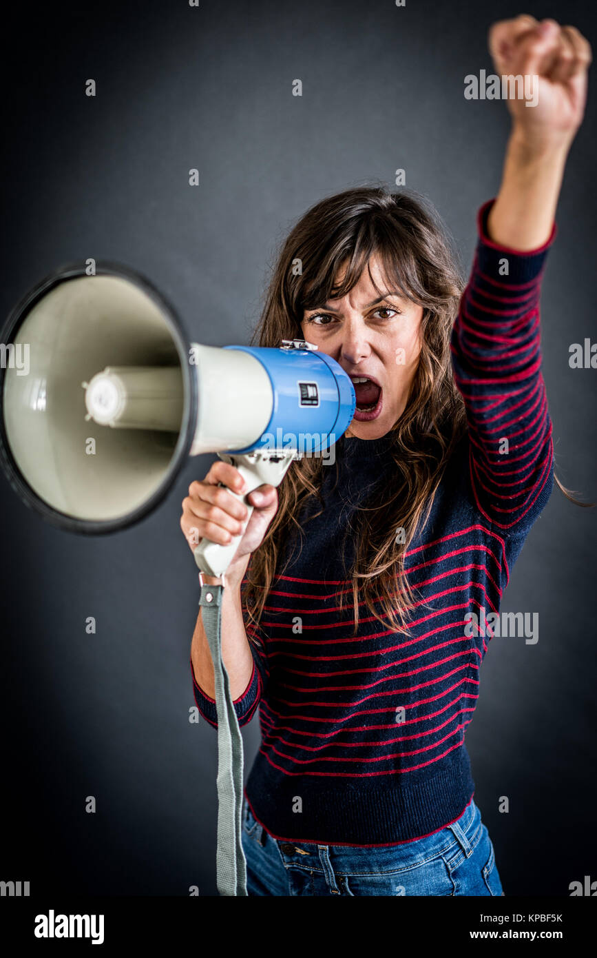 Woman using megaphone Stock Photo - Alamy