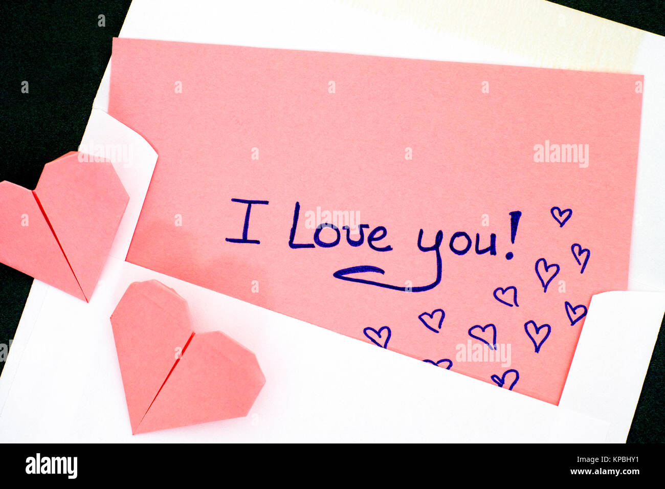 Letter With Text I Love You In Envelope And Two Pink Origami Hearts Black Background Close Up Stock Photo Alamy