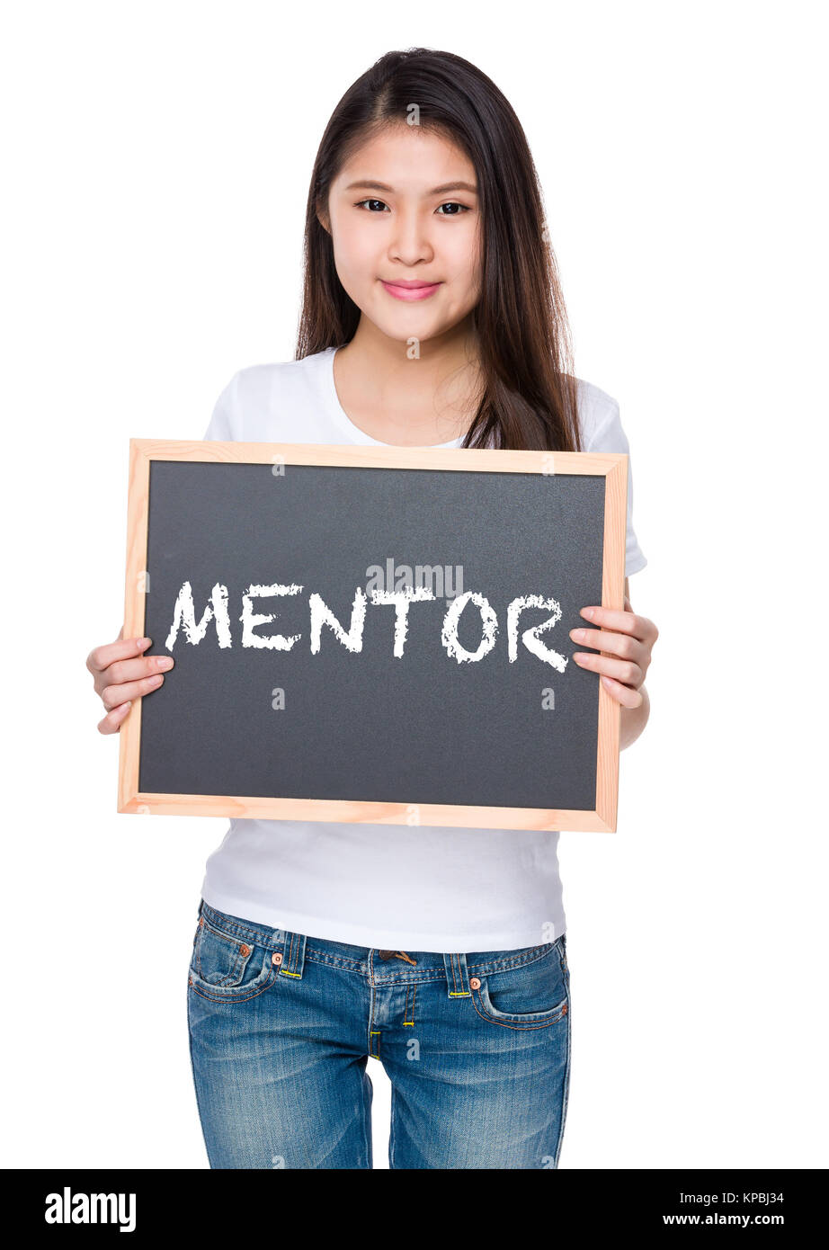 Young woman hold with chalkboard and showing a word mentor Stock Photo