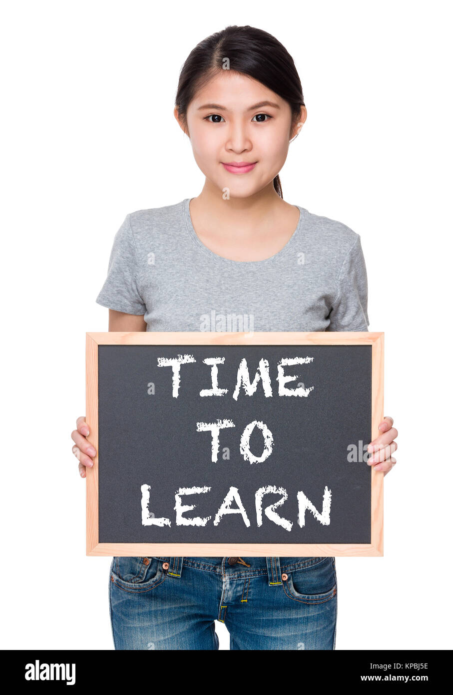 Woman hold with chalkboard and showing phrase time to learn Stock Photo