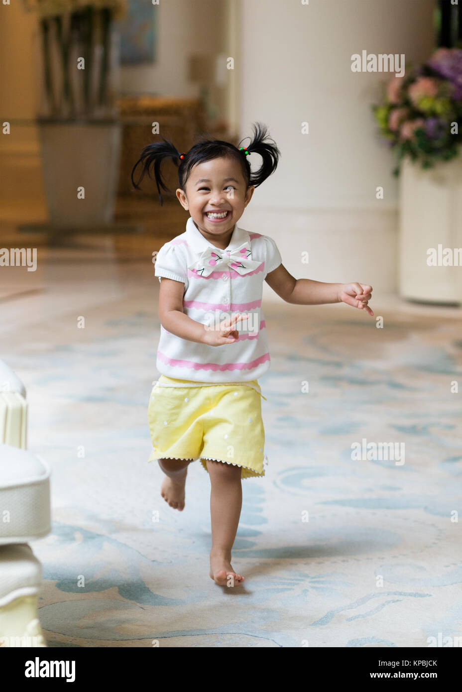 Asian little girl playing at home Stock Photo - Alamy