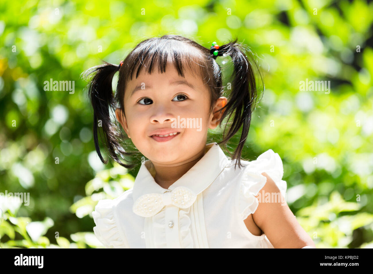 Cute girl lay at outdoor Stock Photo - Alamy