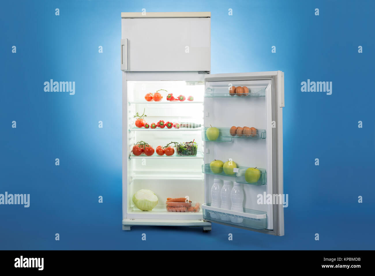 Open Refrigerator Full Of Healthy Food Stock Photo