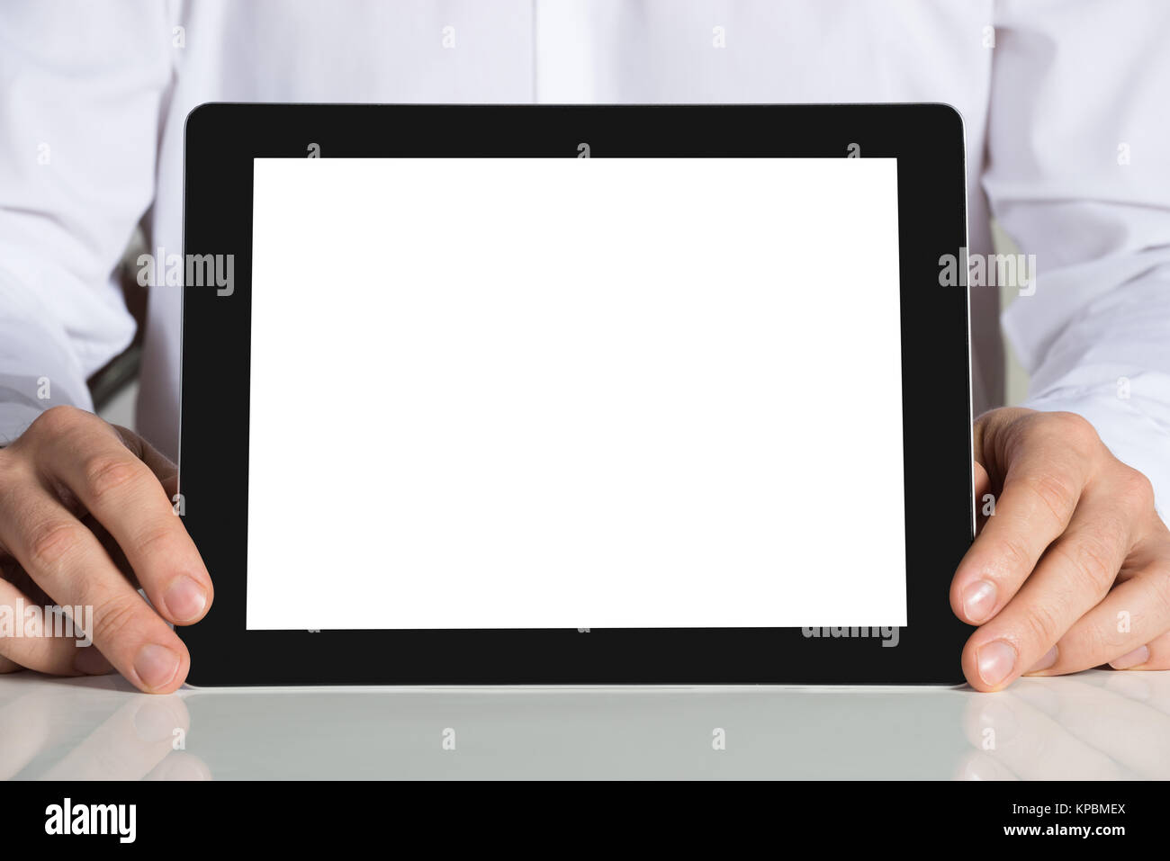 Businessman Holding Tablet Computer With Blank Screen Stock Photo - Alamy