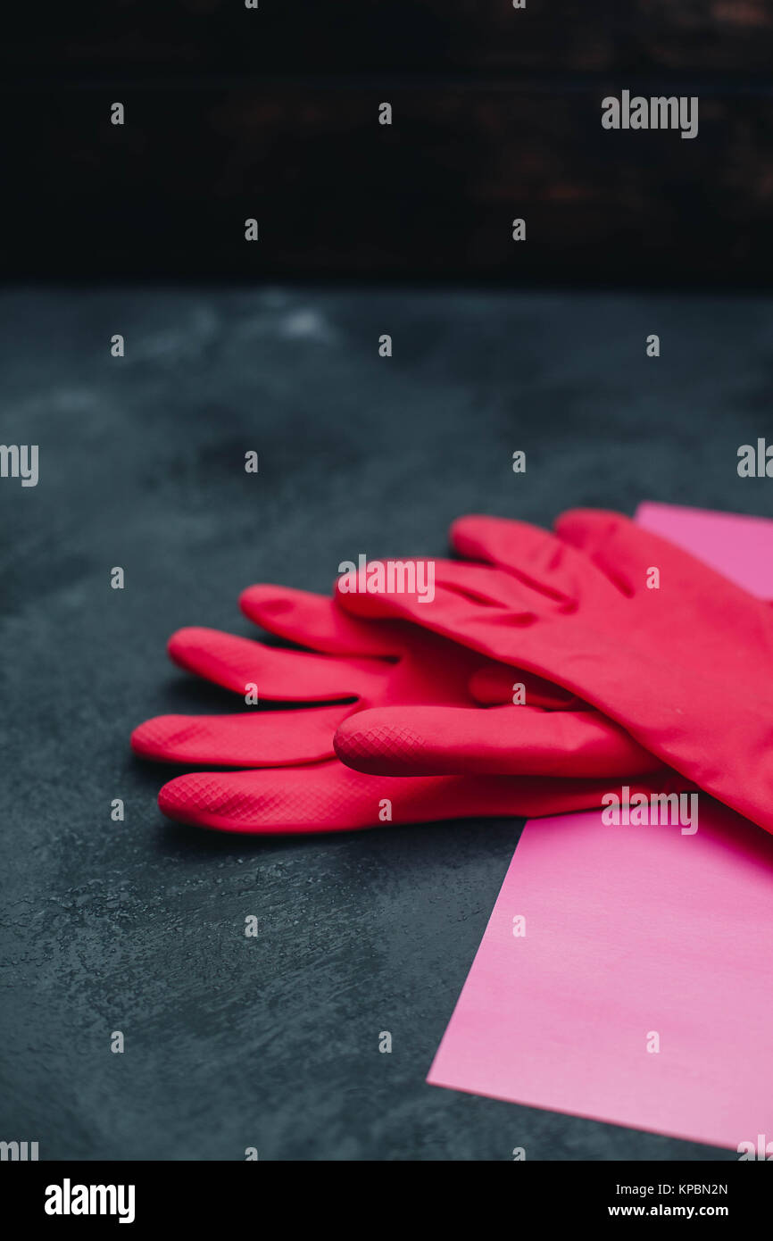 A bright composition with a pair of pink latex gloves on pink on a