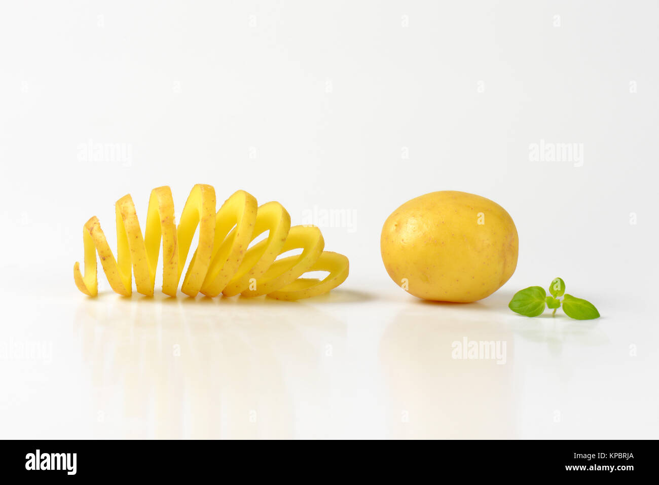 raw spiral cut potato Stock Photo Alamy