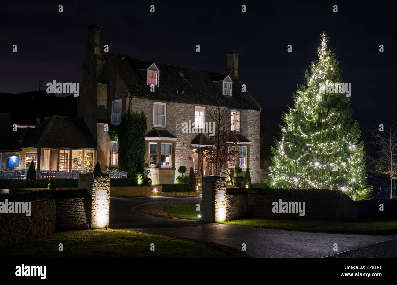 Dormy House Hotel & Spa large Christmas tree with lights at night. Willersey Hill, Broadway, Cotswolds, Worcestershire, England Stock Photo