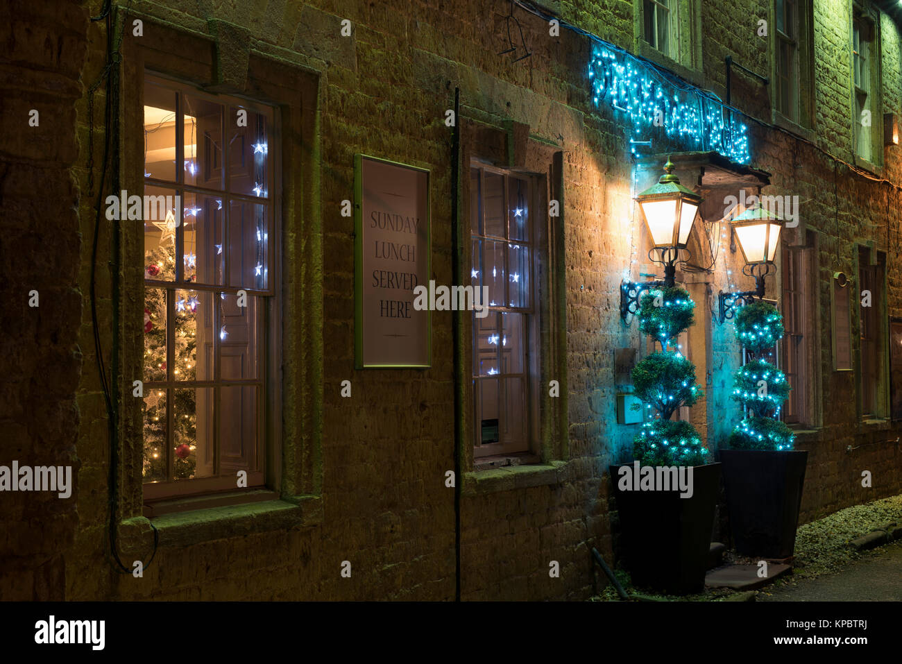 Old Manse Hotel christmas lights at night in Bourton on the Water, Cotswolds, Gloucestershire, Englandfairy lights Stock Photo