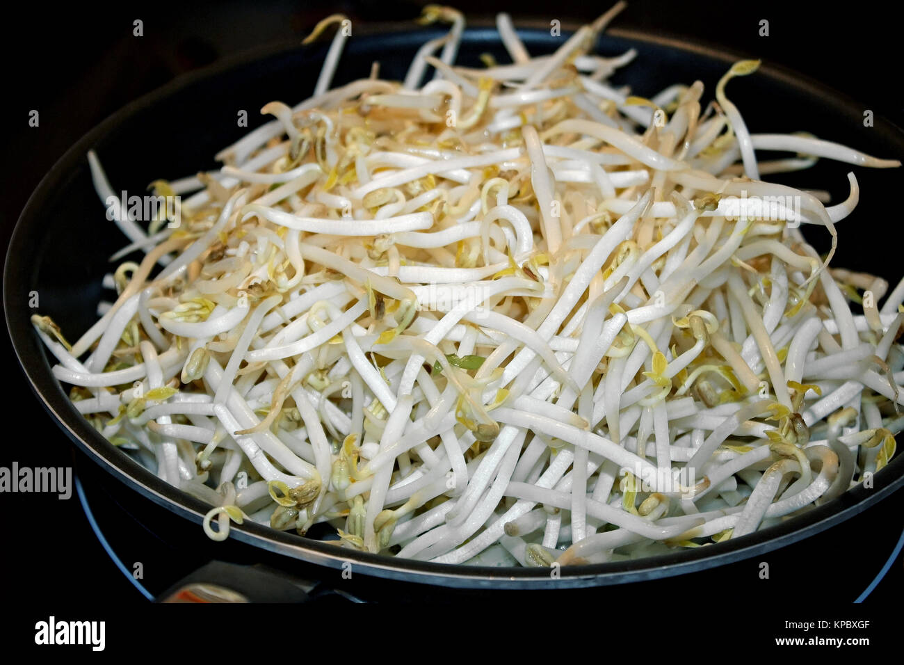 Fresh organic bean sprouts in frying pan ready for cooking Stock Photo