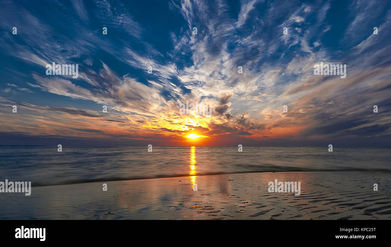 Beautiful sunset on the beach Stock Photo - Alamy
