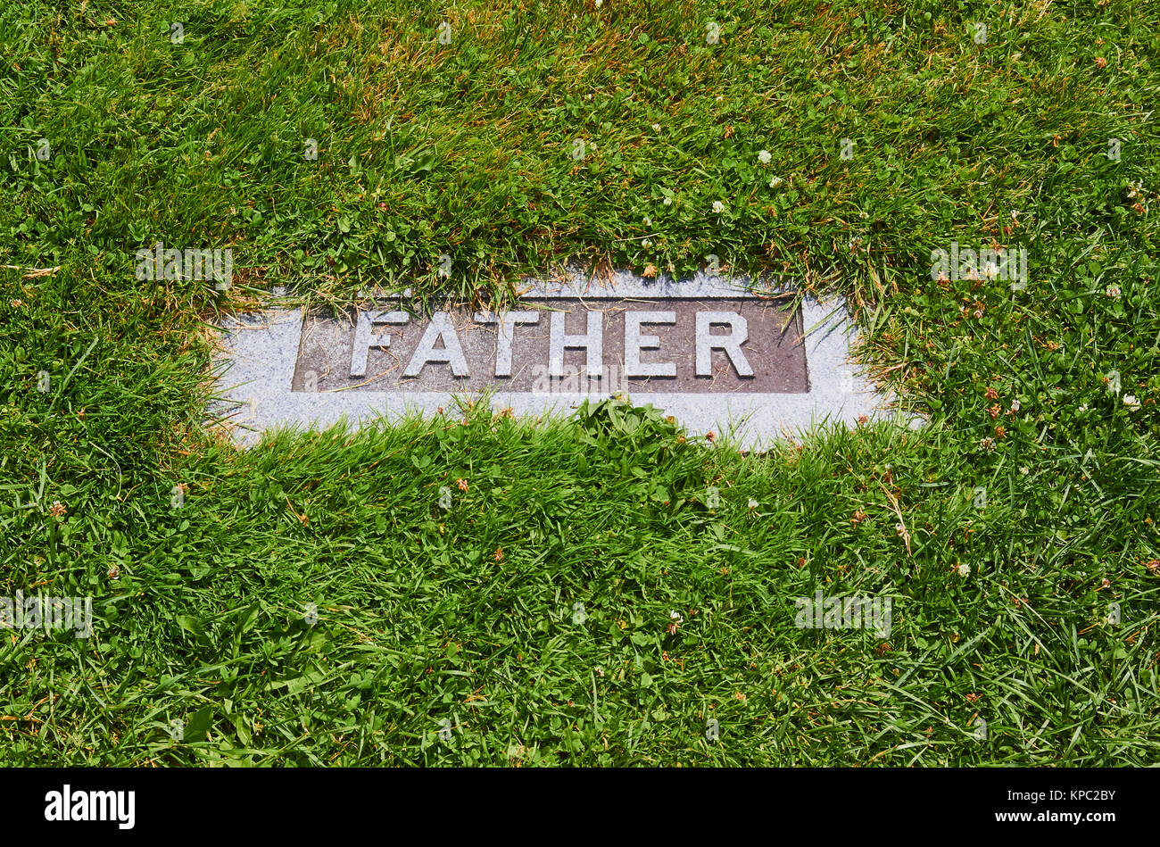 Father on gravestone Stock Photo