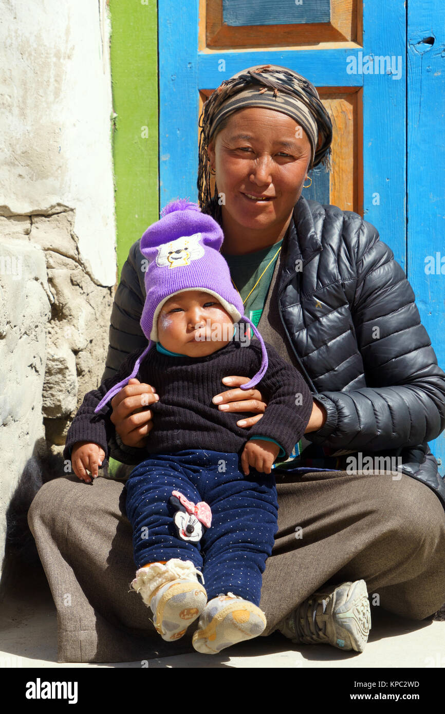 Young Tibetan mother holding her son, Lo Manthang, Upper Mustang region, Nepal. Stock Photo