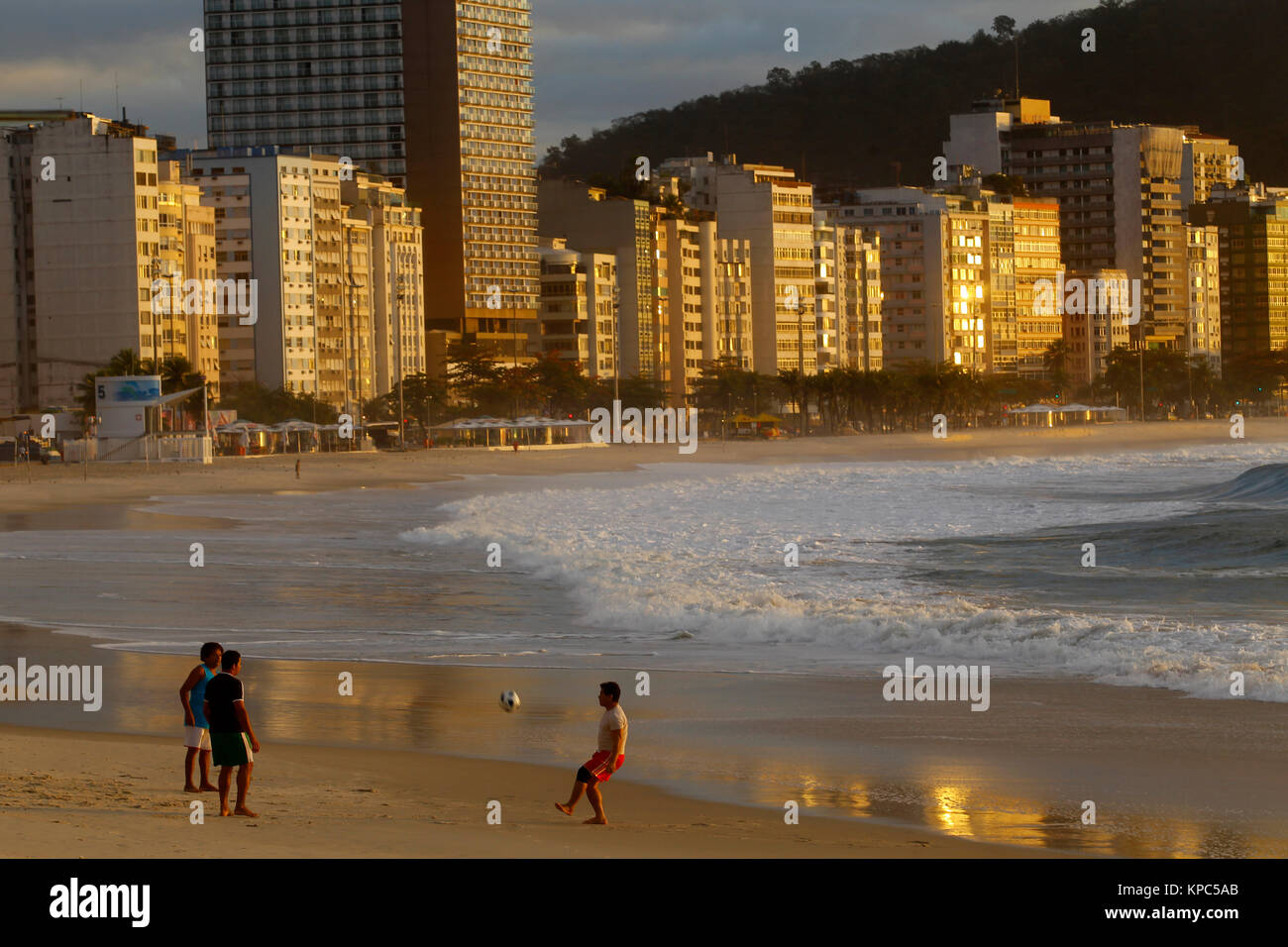 People playing football at Copacabana beach early in the morning, Rio de Janeiro, Brazil Stock Photo