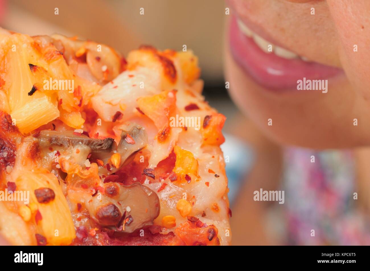 Closeup shot of Asian woman mouth eating pizza Stock Photo Alamy