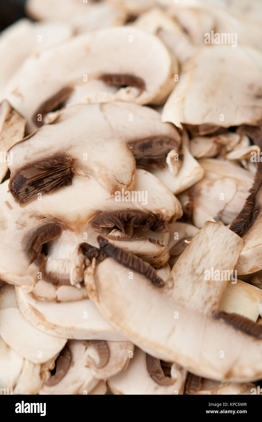 Freshly cut white button mushrooms for cooking Stock Photo Alamy