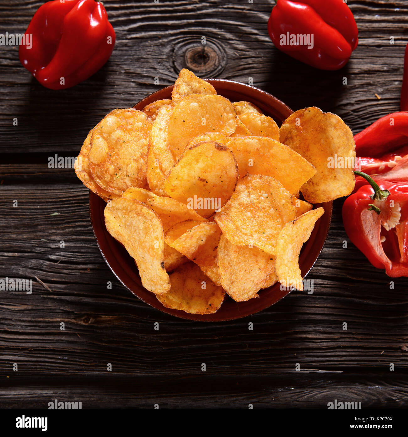 Paprika Potato Chips on rustic background Stock Photo - Alamy
