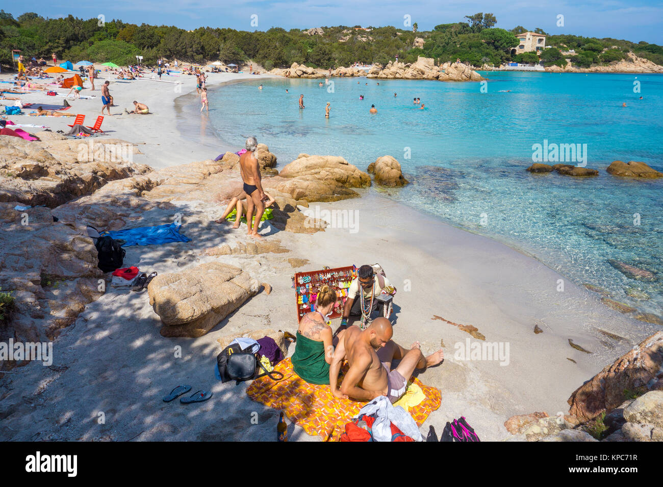 People at idyllic beach with turquoise colour sea and granite rocks at Capriccioli, Costa Smeralda, Sardinia, Italy, Mediterranean sea, Europe Stock Photo