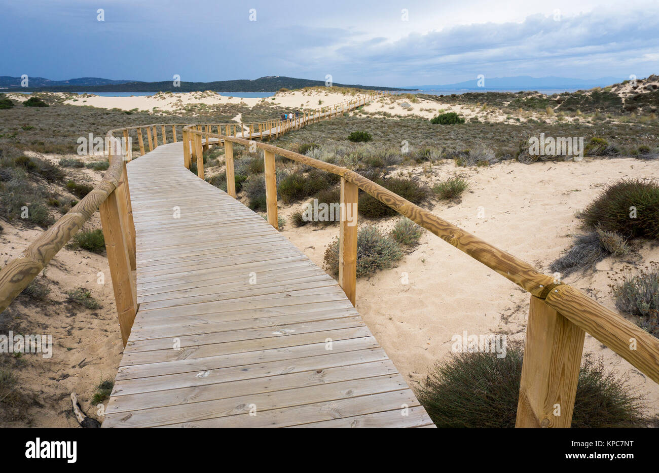 Wooden bridge over dunes leads to the beach Spiaggia del Liscia, Porto Pollo, Sardinia, Italy, Mediterranean  sea, Europe Stock Photo