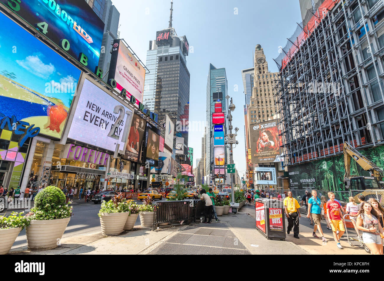 NEW YORK CITY - JULY 22: Undefined people pass through Times Square on ...