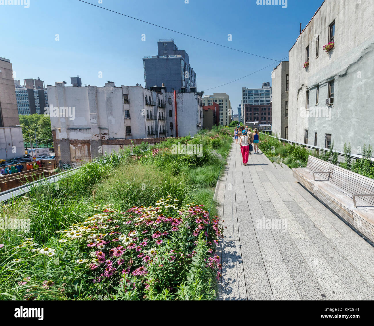 NEW YORK CITY - JULY 22: People walk along the High Line Park on July ...