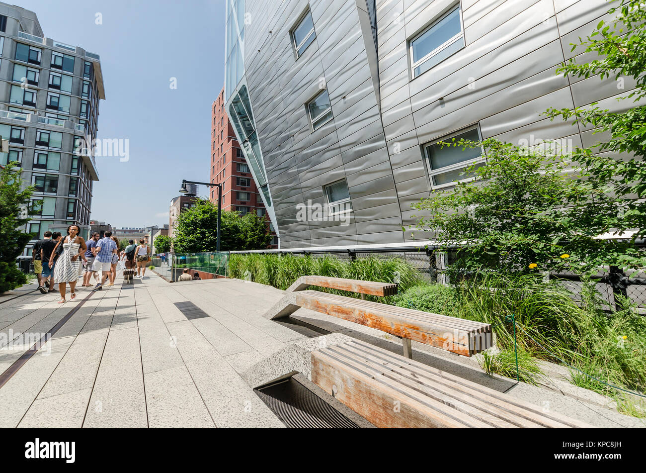 NEW YORK CITY - JULY 22: People walk along the High Line Park on July ...