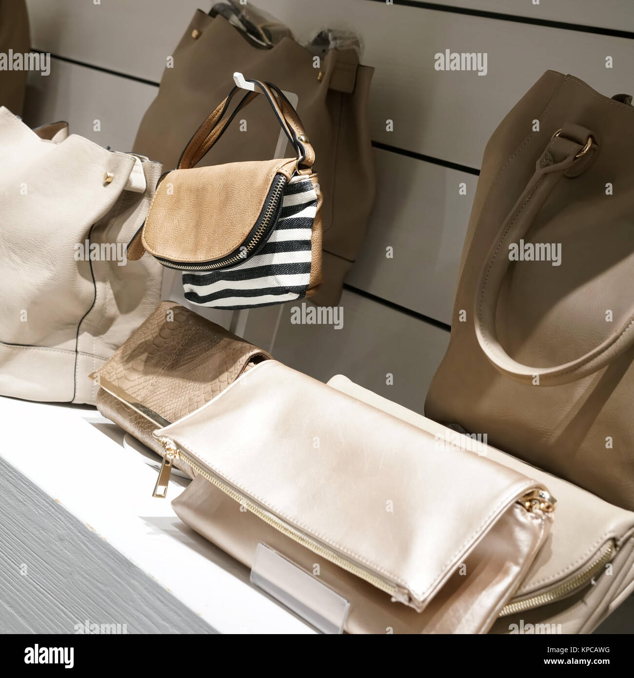 handbags on a shelf in a shop Stock Photo