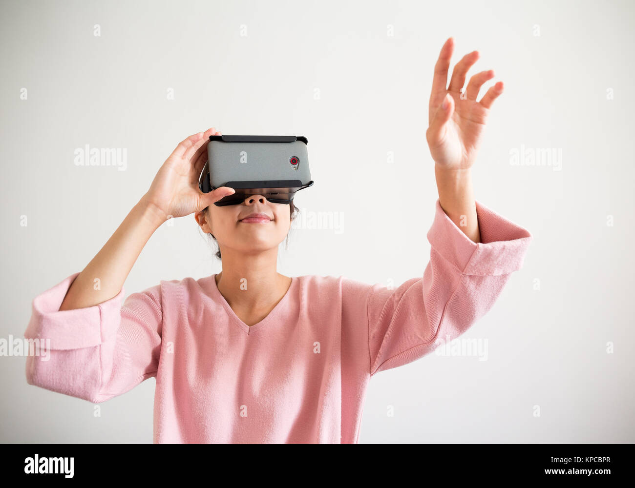 Woman wearing virtual reality goggle Stock Photo - Alamy