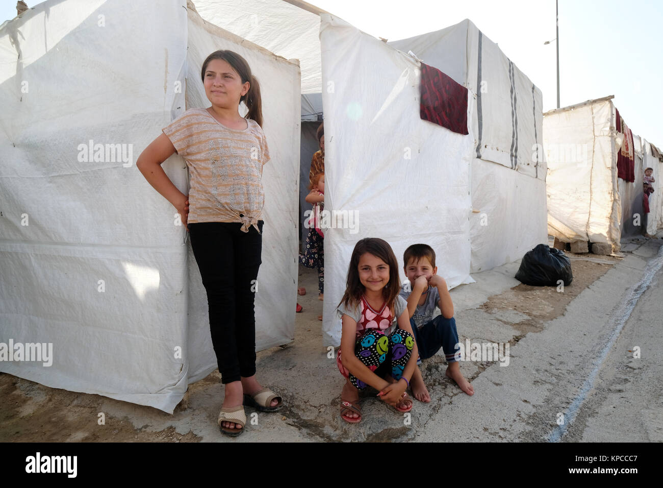 Refugee children in the Sharya tent camp for Yazidi IDP internally displaced people near Duhok, northern Iraq, Kurdistan Region, Iraq Stock Photo
