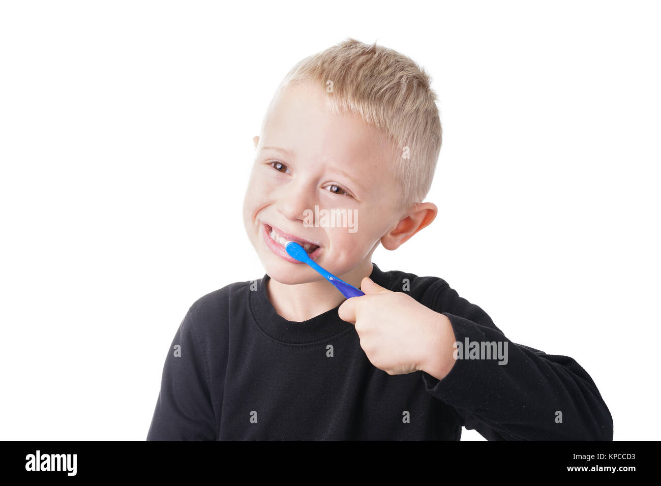 Boy brushes his teeth Stock Photo