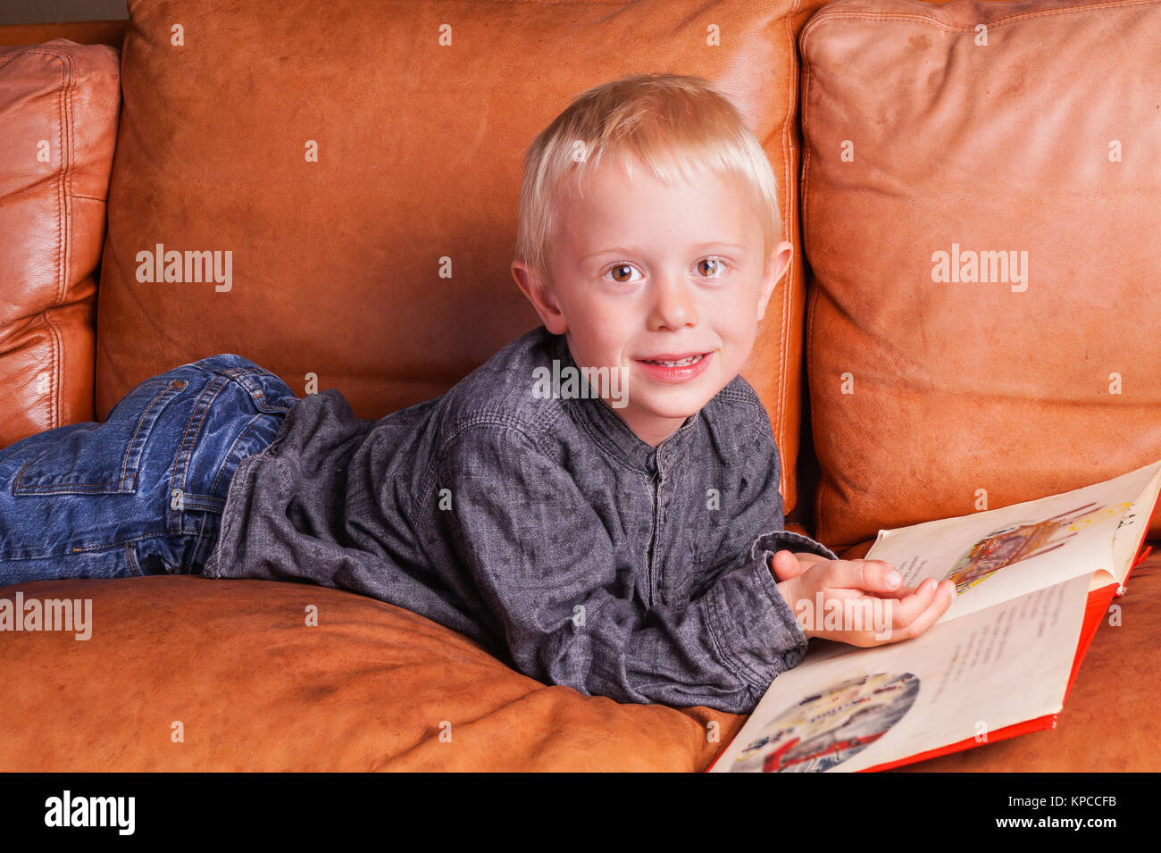 Child reads in one Book Stock Photo