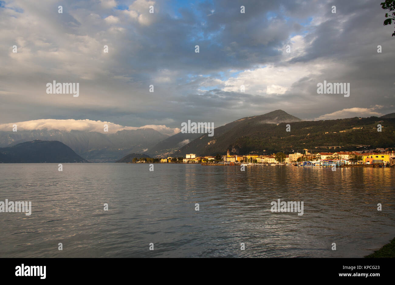 Lake Iseo, Italy. Picturesque dusk view of Lake Iseo, with the town of Iseo on the right of the image and the island of Monte Isola on the left. Stock Photo