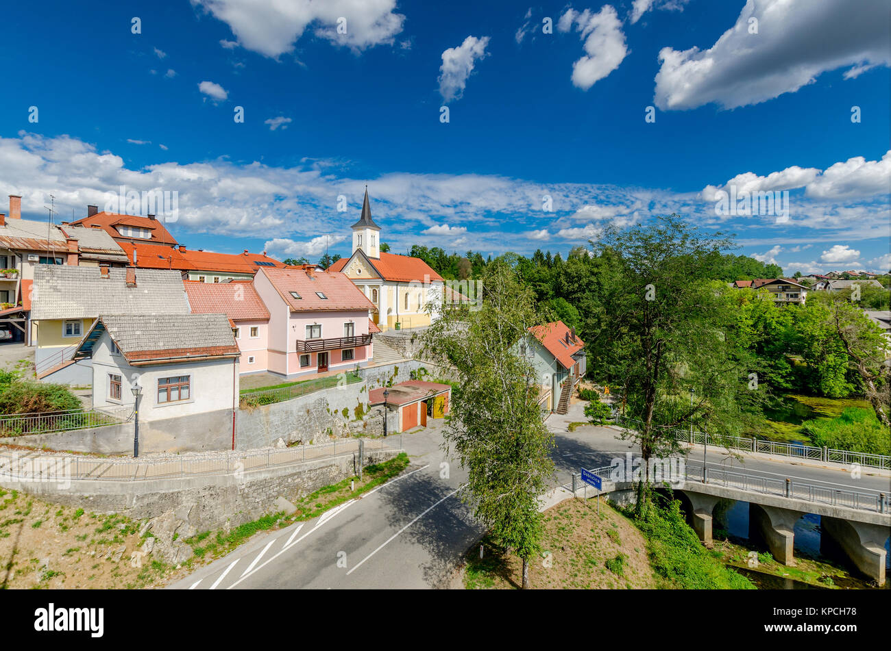 Lahinja river bank in town of Crnomelj, Holy Spirit Church, Bela Krajina (White Carniola) region in Slovenia, Europe. Stock Photo