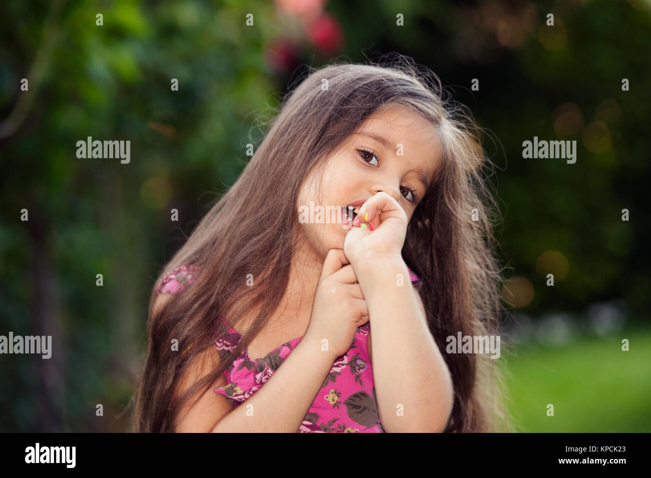 Little girl fingers in mouth Stock Photo