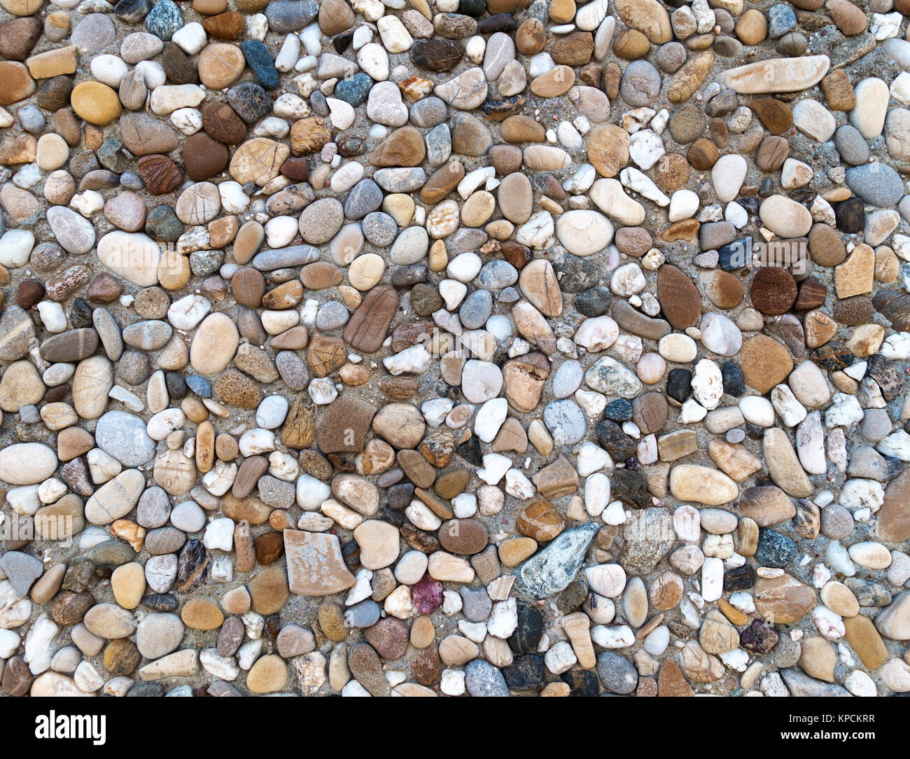 colored aggregate concrete with gray,brown and blue pebbles Stock Photo