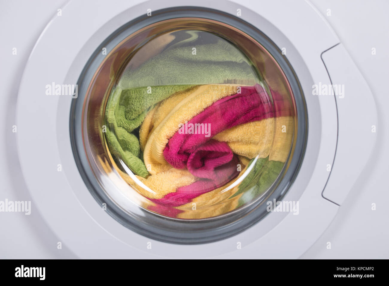 Washing Machine Full Of Clothes Stock Photo Alamy