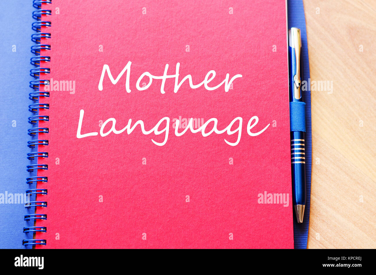 Mother language write on notebook Stock Photo