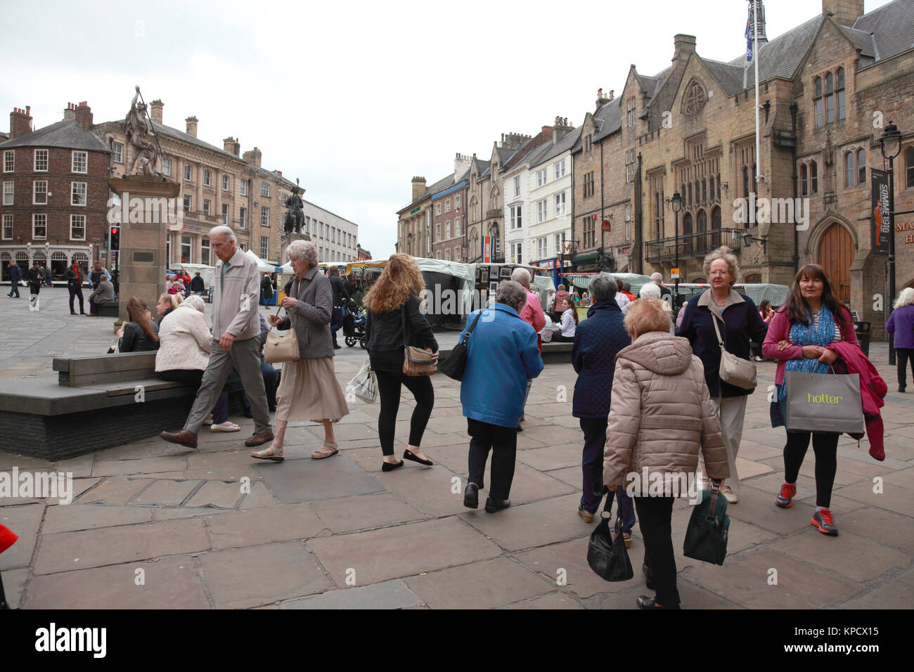 The outdoor Saturday market in Market Place, Durham, busy with shoppers Stock Photo