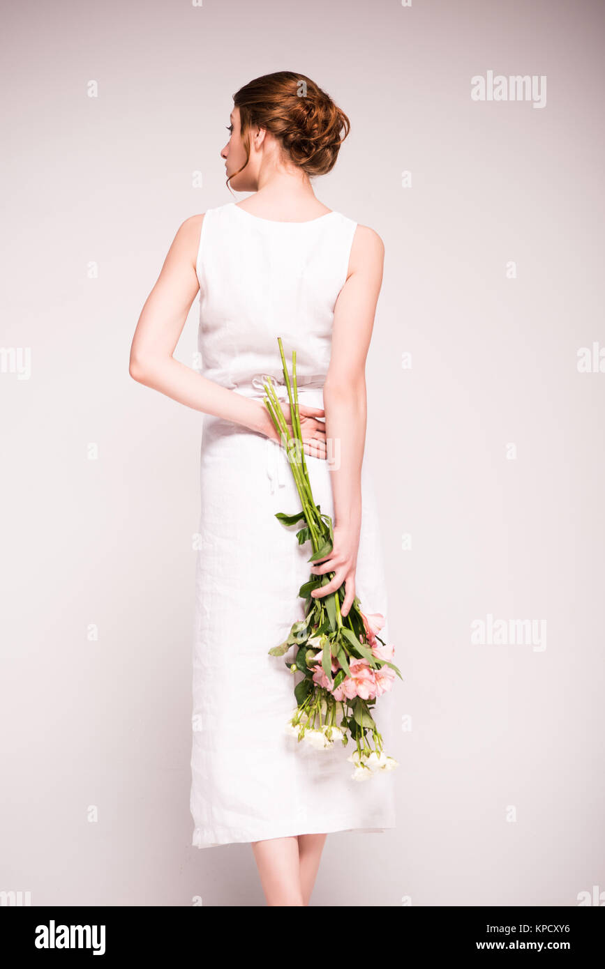 girl in white dress with flowers Stock Photo
